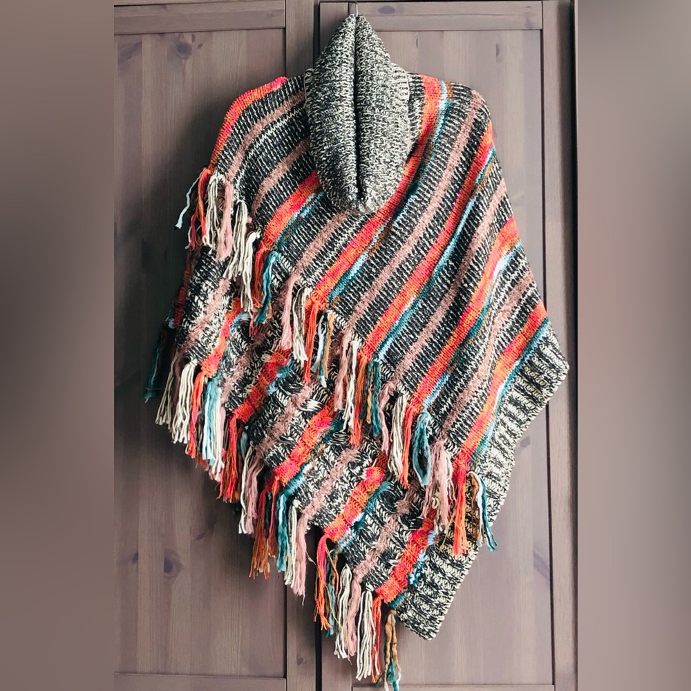 Anthropologie Tassled Turtleneck Poncho
NWOT never worn! 
Pretty colors, soft!